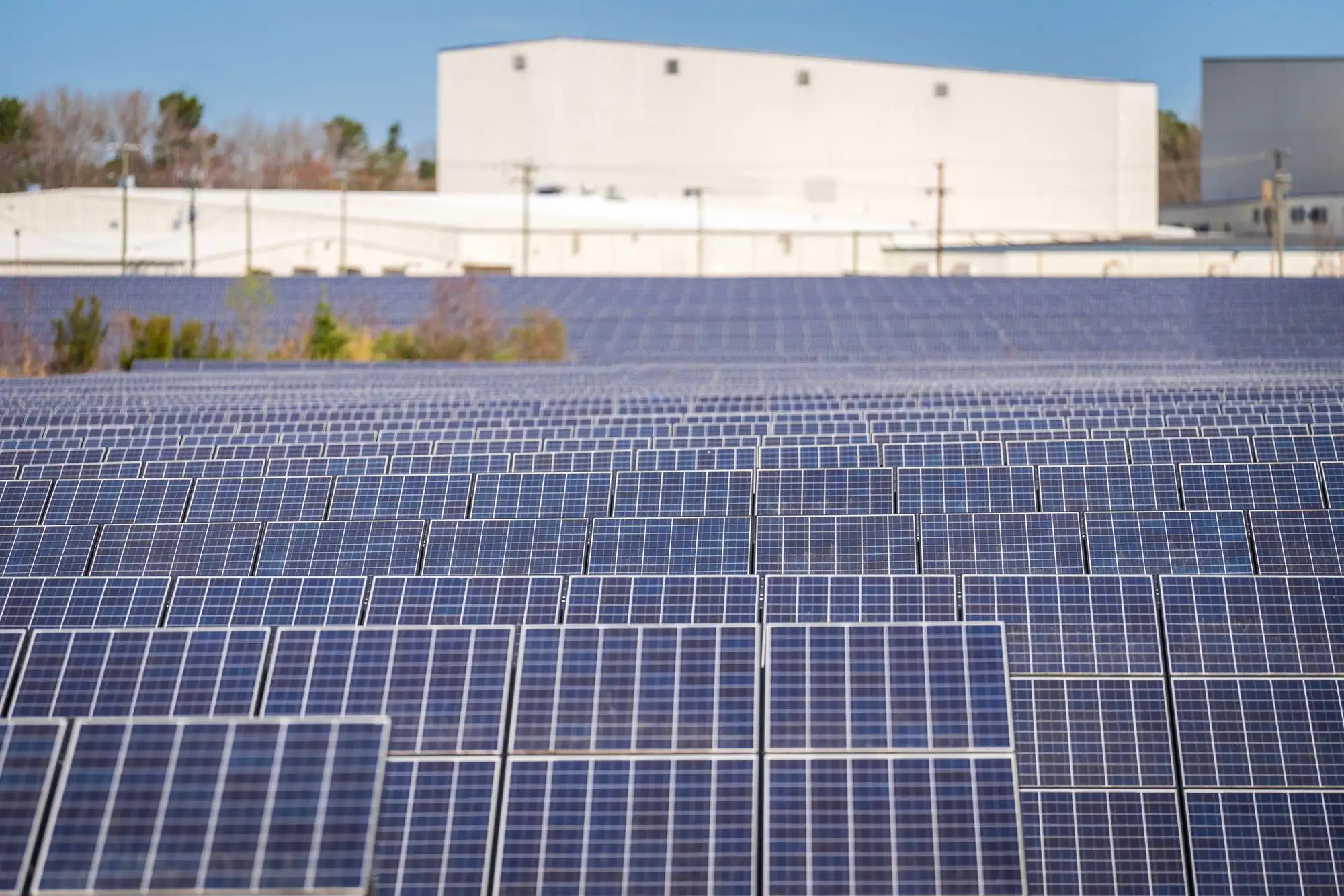 Solar farm beside an industrial site