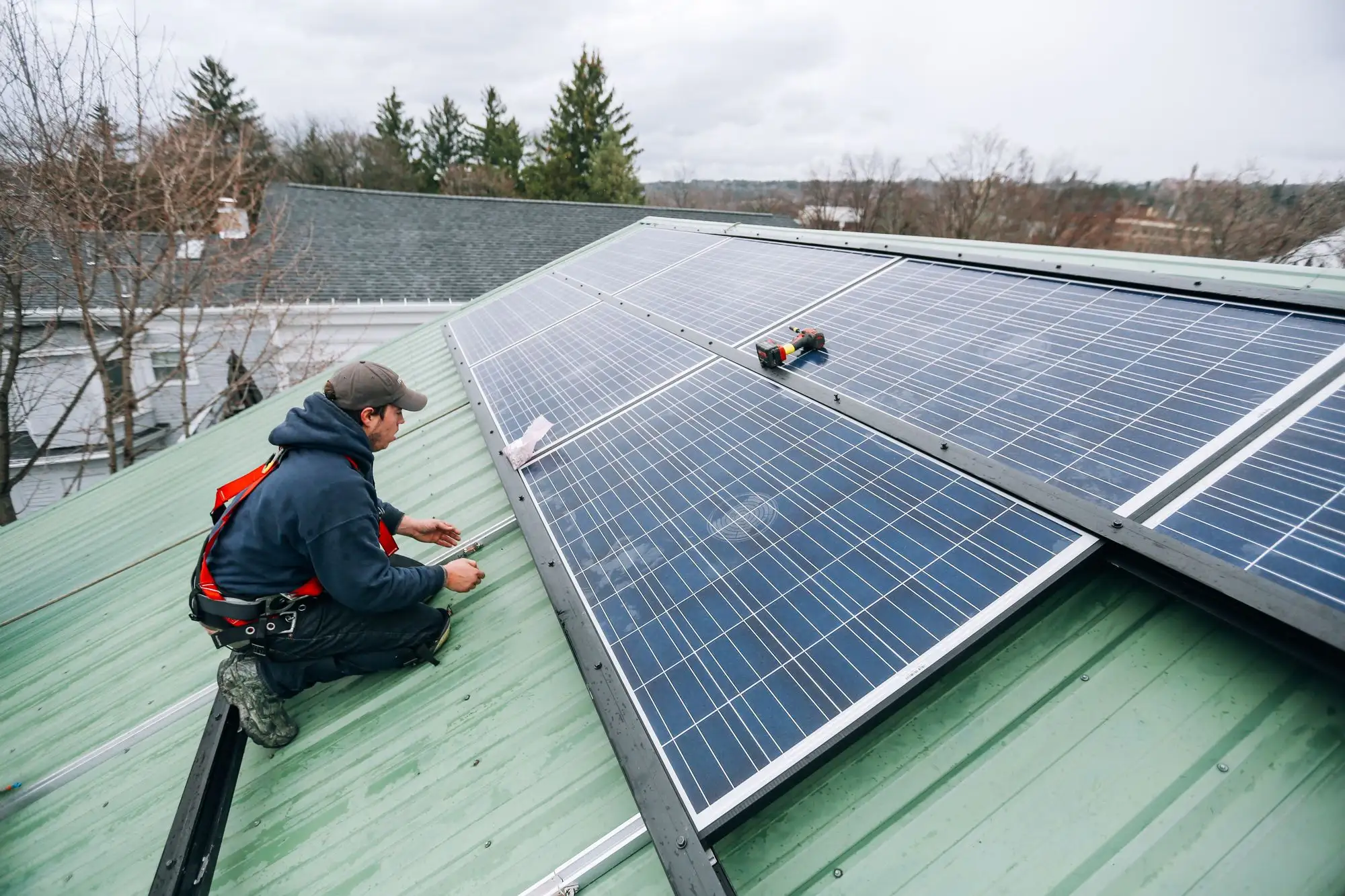 Technician working on a rooftop solar installation